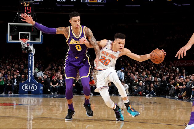 NEW YORK, NY MARCH 17:  Kevin Knox #20 of the New York Knicks handles the ball against Kyle Kuzma #0 of the Los Angeles Lakers during the game on March 17, 2019 at Madison Square Garden in New York City, New York.  NOTE TO USER: User expressly acknowledges and agrees that, by downloading and or using this photograph, User is consenting to the terms and conditions of the Getty Images License Agreement. Mandatory Copyright Notice: Copyright 2019 NBAE  (Photo by Nathaniel S. Butler/NBAE via Getty Images)