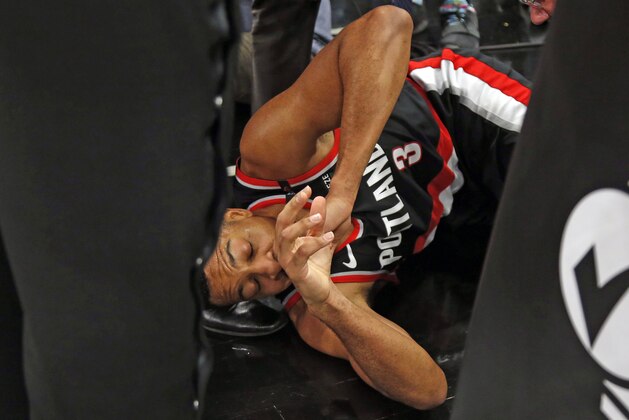 SAN ANTONIO, TX - MARCH 16:  C.J. McCollum #3 of the Portland Trail Blazers  was injured after a drive to the basket against the San Antonio Spurs at AT&T Center on March 16, 2019 in San Antonio, Texas.  NOTE TO USER: User expressly acknowledges and agrees that , by downloading and or using this photograph, User is consenting to the terms and conditions of the Getty Images License Agreement. (Photo by Ronald Cortes/Getty Images)