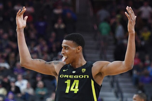 LAS VEGAS, NEVADA - MARCH 16:  Kenny Wooten #14 of the Oregon Ducks celebrates on the court after a Washington Huskies turnover during the championship game of the Pac-12 basketball tournament at T-Mobile Arena on March 16, 2019 in Las Vegas, Nevada. The Ducks defeated the Huskies 68-48.  (Photo by Ethan Miller/Getty Images)