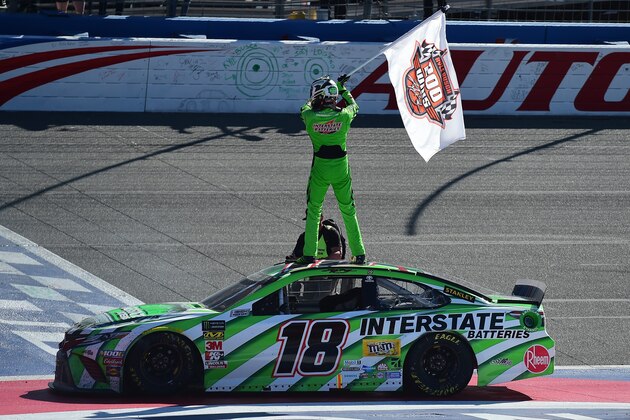 FONTANA, CA - MARCH 17:  Kyle Busch, driver of the #18 Interstate Batteries Toyota, celebrates after winning the Monster Energy NASCAR Cup Series Auto Club 400 and winning his 200th NASCAR race at Auto Club Speedway on March 17, 2019 in Fontana, California.  (Photo by Jared C. Tilton/Getty Images)