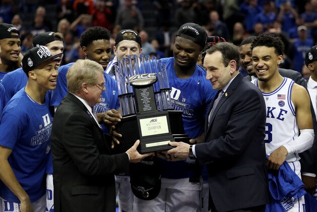 CHARLOTTE, NORTH CAROLINA - MARCH 16: Head coach Mike Krzyzewski of the Duke Blue Devils accepts the ACC Championship trophy after defeating the Florida State Seminoles 73-63 in the championship game of the 2019 Men's ACC Basketball Tournament at Spectrum Center on March 16, 2019 in Charlotte, North Carolina. (Photo by Streeter Lecka/Getty Images)