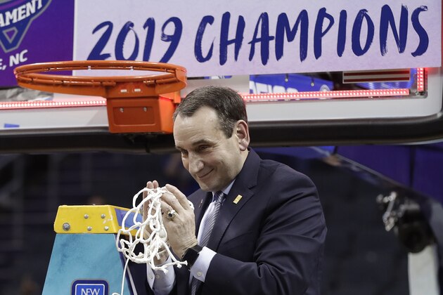 Duke head coach Mike Krzyzewski celebrates Duke's win over Florida State after cutting down a net after the NCAA college basketball championship game of the Atlantic Coast Conference tournament in Charlotte, N.C., Saturday, March 16, 2019. (AP Photo/Nell Redmond)