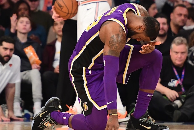 NEW YORK, NEW YORK - MARCH 17: LeBron James #23 of the Los Angeles Lakers is fouled by Mario Hezonja #8 of the New York Knicks during the second half of the game at Madison Square Garden on March 17, 2019 in New York City. NOTE TO USER: User expressly acknowledges and agrees that, by downloading and or using this photograph, User is consenting to the terms and conditions of the Getty Images License Agreement. (Photo by Sarah Stier/Getty Images)