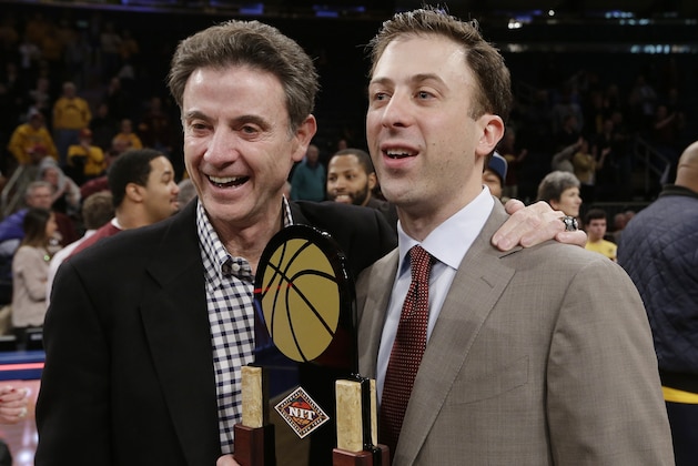 Minnesota coach Richard Pitino, right, stands with his father, Rick Pitino, after Minnesota's 65-63 win over SMU in an NCAA college basketball game in the final of the NIT on Thursday, April 3, 2014, in New York. (AP Photo/Frank Franklin II)