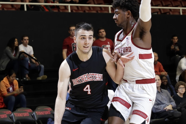 Northeastern guard Vasa Pusica, left, is defended by Stanford guard Daejon Davis during the first half of an NCAA college basketball game Friday, Nov. 17, 2017, in Stanford, Calif. (AP Photo/Marcio Jose Sanchez)