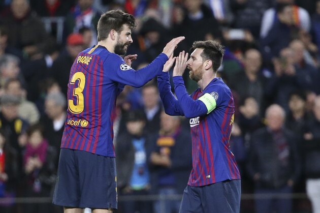 BARCELONA, SPAIN - MARCH 13: Gerard Pique and Lionel Messi of Barcelona celebrate the 5th goal during the UEFA Champions League Round of 16 Second Leg match between FC Barcelona and Olympique Lyonnais (OL, Lyon) at Camp Nou stadium on March 13, 2019 in Barcelona, Spain. (Photo by Jean Catuffe/Getty Images)