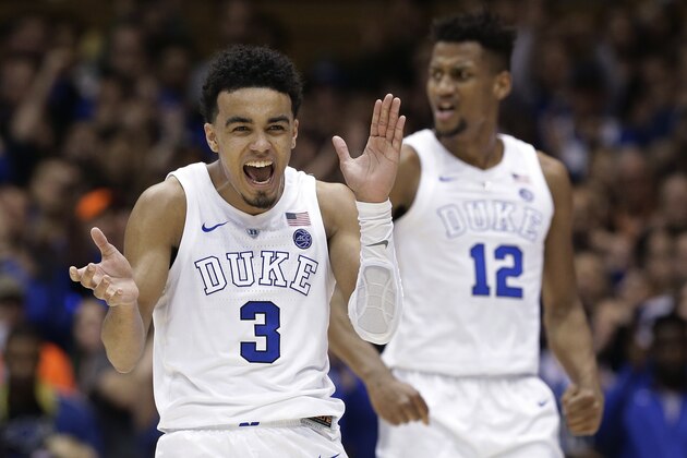 Duke's Tre Jones (3) and Javin DeLaurier (12) react following a play against Wake Forest during the second half of an NCAA college basketball game in Durham, N.C., Tuesday, March 5, 2019. Duke won 71-70. (AP Photo/Gerry Broome)