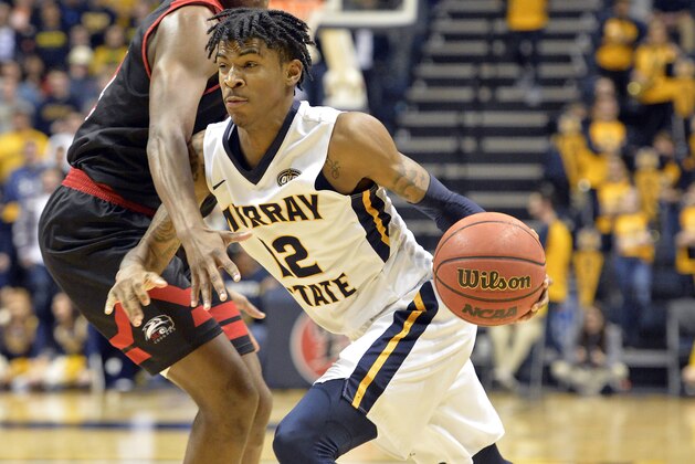 Murray State guard Ja Morant (12) attempts to drive past the defense of SIU Edwardsville guard Cameron Williams (24) during the second half of an NCAA college basketball game in Murray, Ky., Saturday, Feb. 9, 2019. (AP Photo/Timothy D. Easley)