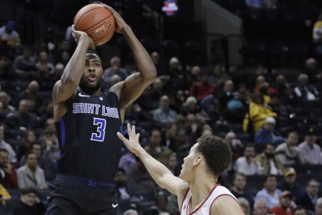 Saint Louis' Javon Bess (3) shoots over Davidson's Kellan Grady (31) during the second half of an NCAA college basketball game in the semifinal round of the Atlantic 10 men's tournament Saturday, March 16, 2019, in New York. Saint Louis won 67-44. (AP Photo/Frank Franklin II)