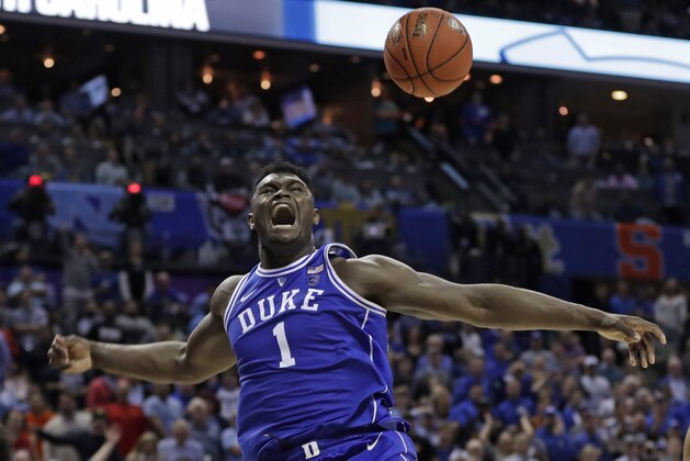 Duke's Zion Williamson (1) reacts after a dunk against North Carolina during the second half of an NCAA college basketball game in the Atlantic Coast Conference tournament in Charlotte, N.C., Friday, March 15, 2019. (AP Photo/Nell Redmond)
