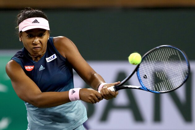 INDIAN WELLS, CALIFORNIA - MARCH 11: Naomi Osaka of Japan returns a shot to Danielle Collins during the BNP Paribas Open at the Indian Wells Tennis Garden on March 11, 2019 in Indian Wells, California. (Photo by Matthew Stockman/Getty Images)