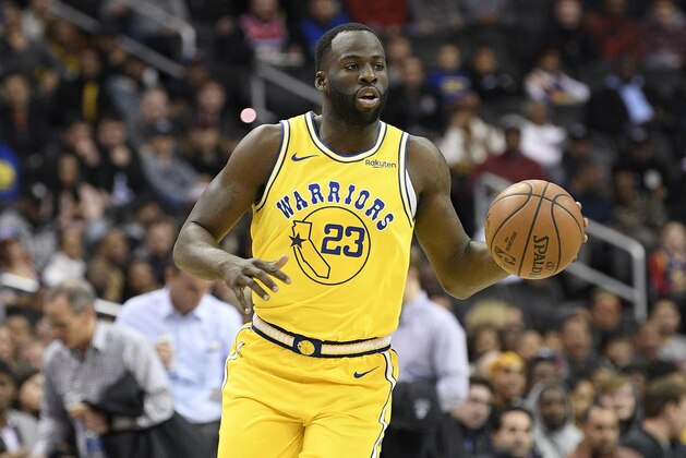 Golden State Warriors forward Draymond Green (23) dribbles the ball during the first half of an NBA basketball game against the Washington Wizards, Thursday, Jan. 24, 2019, in Washington. (AP Photo/Nick Wass)