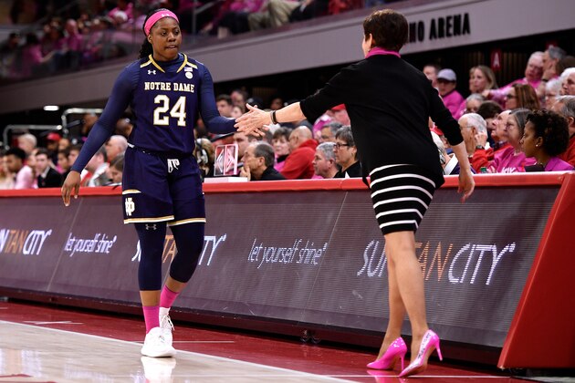 RALEIGH, NC - FEBRUARY 18: Head coach Muffet McGraw of the Notre Dame Fighting Irish high-fives Arike Ogunbowale #24 during in the second half of their game against the North Carolina State Wolfpack at Reynolds Coliseum on February 18, 2019 in Raleigh, North Carolina. Notre Dame won 95-72. (Photo by Lance King/Getty Images)