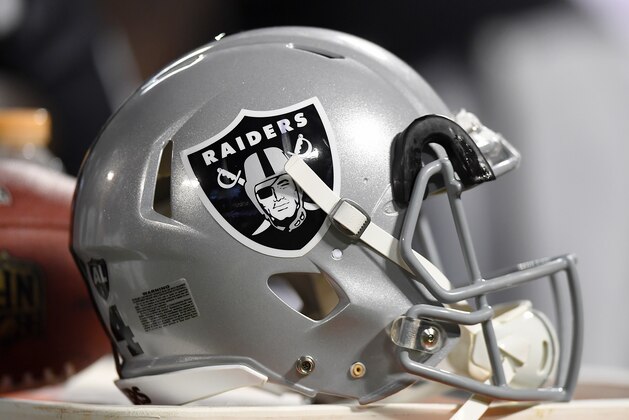 OAKLAND, CA - AUGUST 19:  A detailed view of a helmet belonging to and Oakland Raiders player sitting on top of a Gatorade cooler against the Los Angeles Rams during the fourth quarter of their preseason NFL football game at Oakland-Alameda County Coliseum on August 19, 2017 in Oakland, California. The Ram won the game 24-21.  (Photo by Thearon W. Henderson/Getty Images)