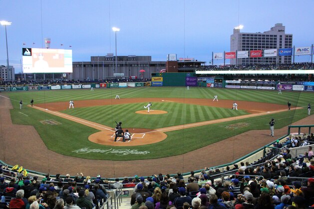 Hartford Yard Goats pitcher Yency Almonte throws the first official pitch at Hartford's new Dunkin' Donuts Park on opening day in Hartford, Conn., Thursday, April 13, 2017. The city and its minor league baseball team are celebrating opening day at the city’s new 6,000-seat stadium, a year late and millions of dollars over budget. (AP Photo/Pat Eaton-Robb)