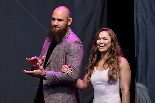 LAS VEGAS, NV - JULY 05:  Mixed martial artist Travis Browne (L) walks onstage with his wife Ronda Rousey as she becomes the first female inducted into the UFC Hall of Fame at The Pearl concert theater at Palms Casino Resort on July 5, 2018 in Las Vegas, Nevada.  (Photo by Ethan Miller/Getty Images)