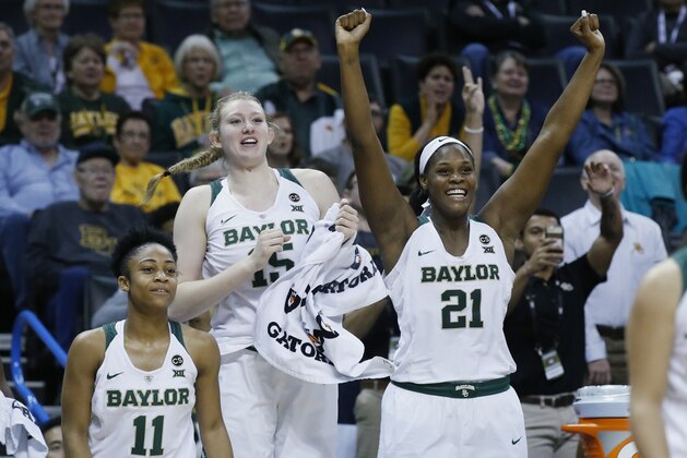 FILE - In this Saturday, March 3, 2018, file photo, Baylor guard Alexis Morris (11), Lauren Cox, center, and center Kalani Brown (21) celebrate in the second half of an NCAA college basketball game against Kansas State in the quarterfinals of the women's Big 12 conference tournament in Oklahoma City. Baylor opens NCAA Tournament play at home for the sixth year in a row. The Lady Bears have arguably the best inside duo in the nation, with 6-7 Big 12 Player of the Year Kalani Brown and 6-4 Lauren Cox. (AP Photo/Sue Ogrocki, File)