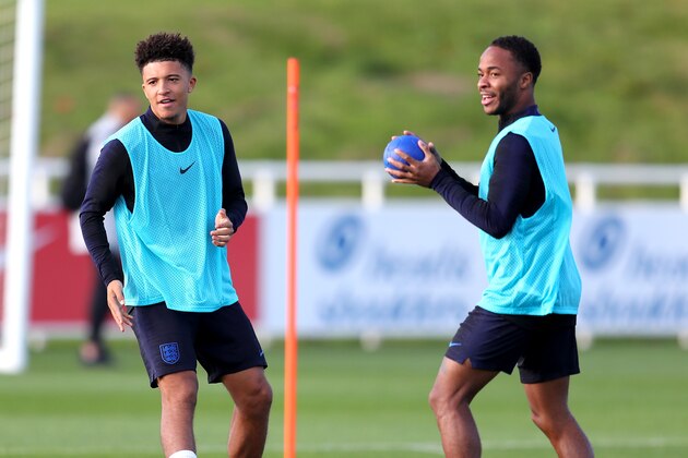 BURTON-UPON-TRENT, ENGLAND - OCTOBER 11: Jadon Sancho of England and Raheem Sterling of England train during the England Training Session at St Georges Park on October 11, 2018 in Burton-upon-Trent, England.  (Photo by Catherine Ivill/Getty Images)