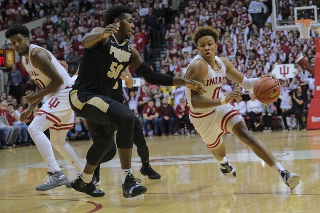 Indiana guard Romeo Langford (0) goes around Purdue forward Trevion Williams (50) during the second half of an NCAA college basketball game in Bloomington, Ind., Tuesday, Feb. 19, 2019. Purdue won 48-46. (AP Photo/AJ Mast)