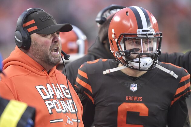 Cleveland Browns offensive coordinator Freddie Kitchens, left, talks with quarterback Baker Mayfield (6) in the fourth quarter of an NFL football game against the Cincinnati Bengals, Sunday, Dec. 23, 2018, in Cleveland. The Browns won 28-16. (AP Photo/David Richard)