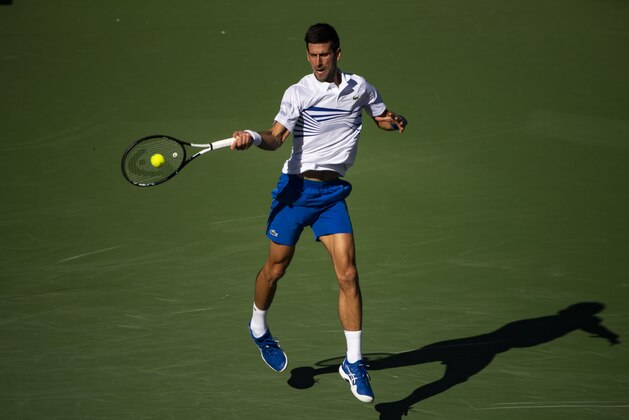 INDIAN WELLS, CALIFORNIA - MARCH 12: Novak Djokovic of Serbia 
hits a forehand against Philipp Kohlschreiber of Germany on March 12, 2019, in the third round of the BNP Paribas Open at Indian Wells Tennis Garden  in Indian Wells, California. (Photo by TPN/Getty Images)