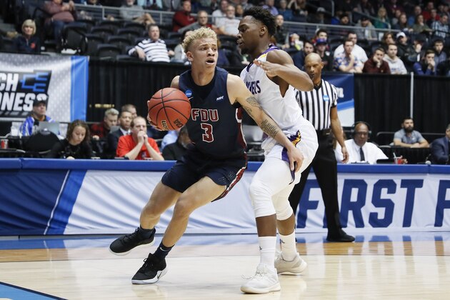 Fairleigh Dickinson's Jahlil Jenkins (3) drives against Prairie View A&M's Taishaun Johnson, right, during the first half of a First Four game of the NCAA college basketball tournament, Tuesday, March 19, 2019, in Dayton, Ohio. (AP Photo/John Minchillo)