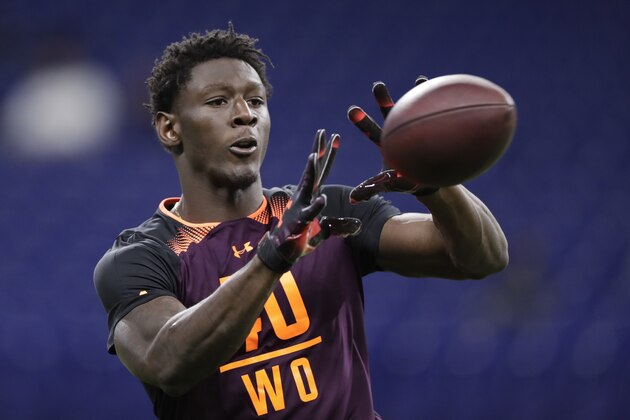 Georgia wide receiver Riley Ridley runs a drill at the NFL football scouting combine in Indianapolis, Saturday, March 2, 2019. (AP Photo/Michael Conroy)