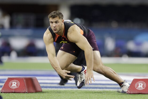 Ohio State defensive lineman Nick Bosa runs a drill during the NFL football scouting combine, Sunday, March 3, 2019, in Indianapolis. (AP Photo/Darron Cummings)