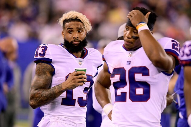 EAST RUTHERFORD, NJ - OCTOBER 11:  Odell Beckham #13 and Saquon Barkley #26 of the New York Giants react against the Philadelphia Eagles at MetLife Stadium on October 11, 2018 in East Rutherford, New Jersey. The Eagles defeated the Giants 34-13.  (Photo by Steven Ryan/Getty Images)