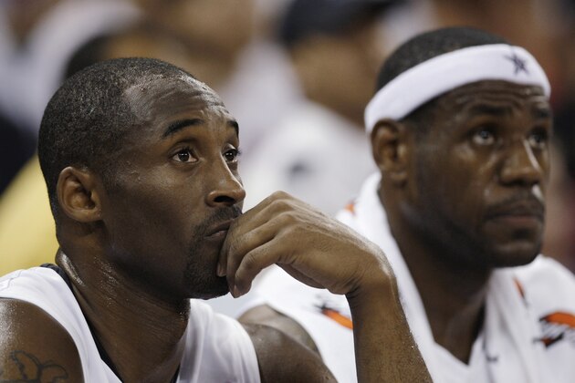 ** FILE ** In this July 31, 2008, file photo, U.S. Olympic basketball team players Kobe Bryant, left, and LeBron James watch the game against Turkey in Macau. The United States won the gold in men's basketball at the Olympics in August. How many of the best players on this team will be back for the 2012 Olympics and does USA Basketball continue to require a three-year commitment from them? The players have served the time Jerry Colangelo, USA Basketball's managing director, required of them for the 2008 Games and are now free to enjoy their summers. (AP Photo/Kin Cheung, File)