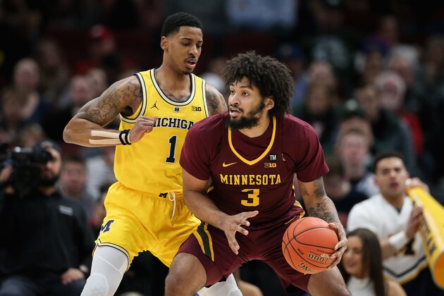 CHICAGO, ILLINOIS - MARCH 16:  Jordan Murphy #3 of the Minnesota Golden Gophers dribbles the ball while being guarded by Charles Matthews #1 of the Michigan Wolverines in the first half during the semifinals of the Big Ten Basketball Tournament at United Center on March 16, 2019 in Chicago, Illinois. (Photo by Dylan Buell/Getty Images)