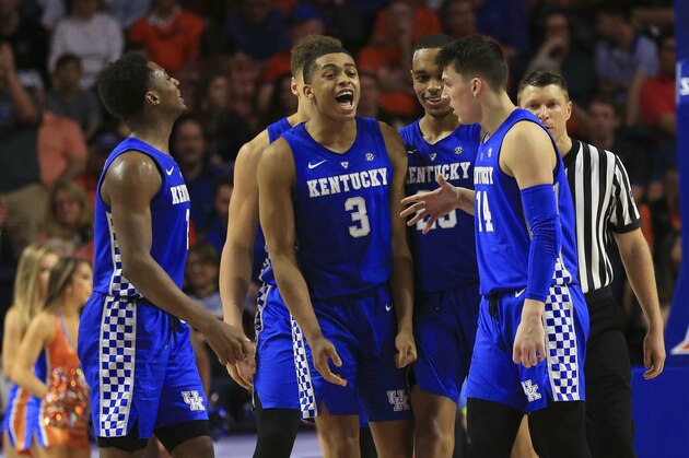 Kentucky guard Ashton Hagans, guard Keldon Johnson, forward PJ Washington and guard Tyler Herro celebrate against Florida during an NCAA college basketball game Saturday, Feb. 2, 2019, in Gainesville, Fla. Kentucky defeated Florida 65-54. (AP Photo/Matt Stamey)