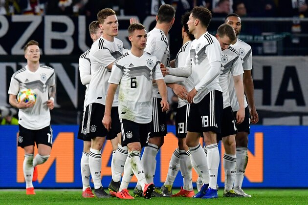 Germany's midfielder Leon Goretzka (3rd R) celebrates scoring the 1-1 equaliser with his team-mates during the friendly football match Germany v Serbia in Wolfsburg, western Germany on March 20, 2019. (Photo by Tobias SCHWARZ / AFP) / RESTRICTIONS: ACCORDING TO DFB RULES IMAGE SEQUENCES TO SIMULATE VIDEO IS NOT ALLOWED DURING MATCH TIME. MOBILE (MMS) USE IS NOT ALLOWED DURING AND FOR FURTHER TWO HOURS AFTER THE MATCH. == RESTRICTED TO EDITORIAL USE == FOR MORE INFORMATION CONTACT DFB DIRECTLY AT +49 69 67880 /         (Photo credit should read TOBIAS SCHWARZ/AFP/Getty Images)