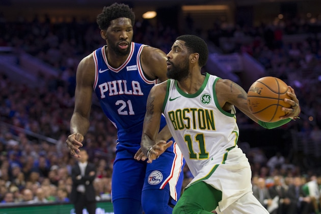 PHILADELPHIA, PA - MARCH 20: Kyrie Irving #11 of the Boston Celtics drives to the basket against Joel Embiid #21 of the Philadelphia 76ers in the first quarter at the Wells Fargo Center on March 20, 2019 in Philadelphia, Pennsylvania. NOTE TO USER: User expressly acknowledges and agrees that, by downloading and or using this photograph, User is consenting to the terms and conditions of the Getty Images License Agreement.(Photo by Mitchell Leff/Getty Images)