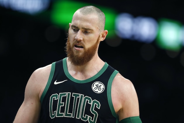 Boston Celtics' Aron Baynes returns to the bench during the second half of an NBA basketball game against the Houston Rockets in Boston, Sunday, March 3, 2019. (AP Photo/Michael Dwyer)