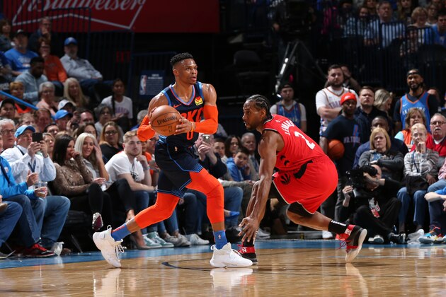OKLAHOMA CITY, OK- MARCH 20: Russell Westbrook #0 of the Oklahoma City Thunder handles the ball against Kawhi Leonard #2 of the Toronto Raptors on March 20, 2019 at Chesapeake Energy Arena in Oklahoma City, Oklahoma. NOTE TO USER: User expressly acknowledges and agrees that, by downloading and or using this photograph, User is consenting to the terms and conditions of the Getty Images License Agreement. Mandatory Copyright Notice: Copyright 2019 NBAE (Photo by Zach Beeker/NBAE via Getty Images)
