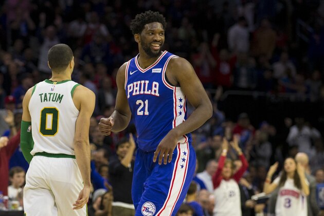 PHILADELPHIA, PA - MARCH 20: Joel Embiid #21 of the Philadelphia 76ers reacts in front of Jayson Tatum #0 of the Boston Celtics after a timeout in the fourth quarter at the Wells Fargo Center on March 20, 2019 in Philadelphia, Pennsylvania. The 76ers defeated the Celtics 118-115. NOTE TO USER: User expressly acknowledges and agrees that, by downloading and or using this photograph, User is consenting to the terms and conditions of the Getty Images License Agreement.(Photo by Mitchell Leff/Getty Images)