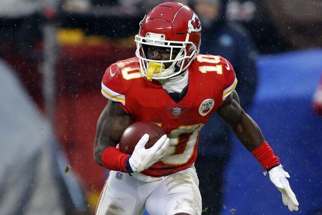 Kansas City Chiefs wide receiver Tyreek Hill (10) carries the ball during the first half of an NFL divisional football playoff game against the Indianapolis Colts in Kansas City, Mo., Saturday, Jan. 12, 2019. (AP Photo/Charlie Neibergall)
