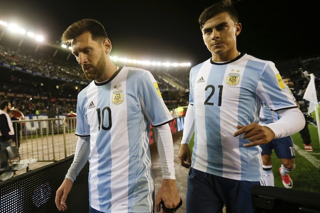 Argentina's Lionel Messi , left, and his teammate Paulo Dybala leave the field at the half time during a 2018 World Cup qualifying soccer match against Venezuela in Buenos Aires, Argentina, Tuesday, Sept. 5, 2017. (AP Photo/Victor R. Caivano)
