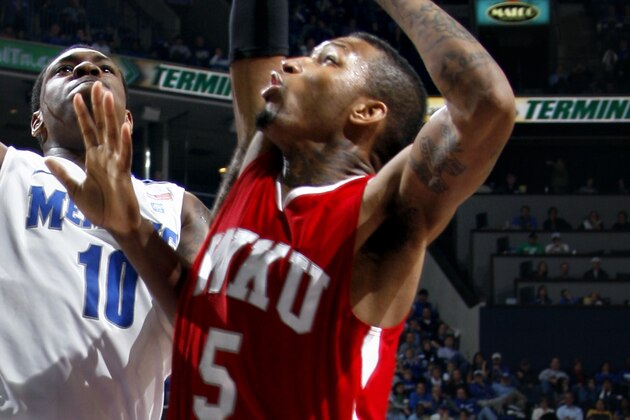 Memphis forward Tarik Black (10) shoots defended by defended by Western Kentucky forward Cliff Dixon (5) in the second half of an NCAA college basketball game Saturday, Dec. 4, 2010, in Memphis, Tenn.  (AP Photo/Nikki Boertman)