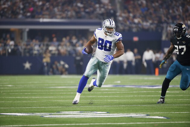 Dallas Cowboys tight end Rico Gathers (80) looks for room against Jacksonville Jaguars defensive tackle Malik Jackson (97) in the first half of an NFL football game in Arlington, Texas, Sunday, Oct. 14, 2018. (AP Photo/Ron Jenkins)