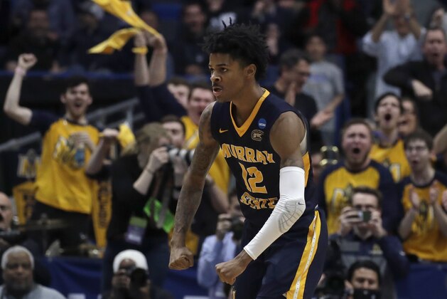 Fans cheer as Murray State's Ja Morant (12) celebrates a basket during the second half of a first round men's college basketball game against Marquette in the NCAA Tournament, Thursday, March 21, 2019, in Hartford, Conn. (AP Photo/Elise Amendola)