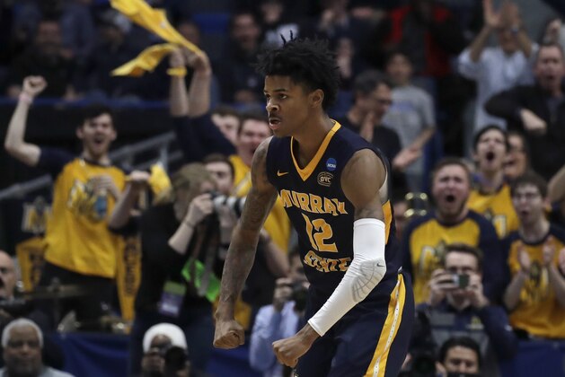 Fans cheer as Murray State's Ja Morant (12) celebrates a basket during the second half of a first round men's college basketball game against Marquette in the NCAA Tournament, Thursday, March 21, 2019, in Hartford, Conn. (AP Photo/Elise Amendola)