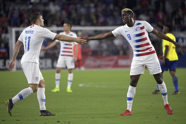 United States forwards Jordan Morris (11) and Gyasi Zardes (9) congratulate each other after a play during the first half of an international friendly soccer match Thursday, March 21, 2019, in Orlando, Fla. (AP Photo/Phelan M. Ebenhack)