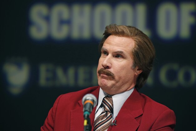 Actor and comedian Will Ferrell, who plays TV anchorman Ron Burgundy, stays in character and speaks during a news conference at Emerson College in Boston, Wednesday, Dec. 4, 2013. The school has changed the name of its School of Communication for one day to honor the fictitious television anchorman. (AP Photo/Elise Amendola)