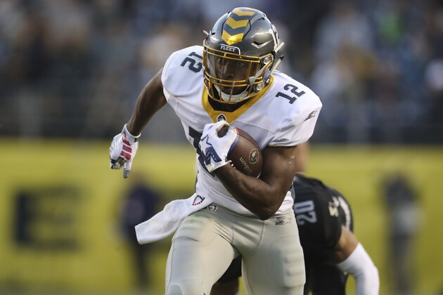San Diego Fleet wide receiver Dontez Ford (12) jukes a second defender in Birmingham Iron defensive back Max Redfield (20) as he runs for a first down after the catch in the second half during a Birmingham Iron at San Diego Fleet AAF football game, Sunday, March 17, 2019, at SDCCU Stadium in San Diego. (AP Photo/Peter Joneleit)