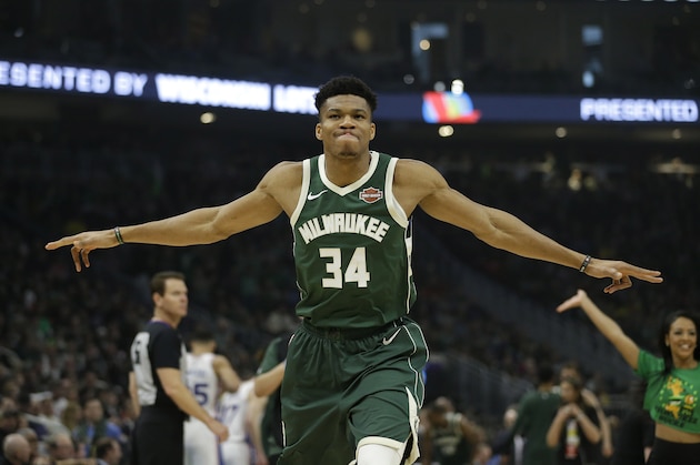 Milwaukee Bucks' Giannis Antetokounmpo stretches before an NBA basketball game against the Philadelphia 76ers Sunday, March 17, 2019, in Milwaukee. (AP Photo/Aaron Gash)