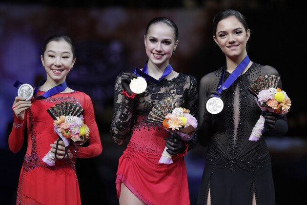 From left, Kazakhstan's Elizabet Tursynbaeva, Russia's Alina Zagitova and Russia's Evgenia Medvedeva display their silver, gold and bronze medals respectively for the ladies free skating during the ISU World Figure Skating Championships at Saitama Super Arena in Saitama, north of Tokyo, Friday, March 22, 2019. (AP Photo/Andy Wong)