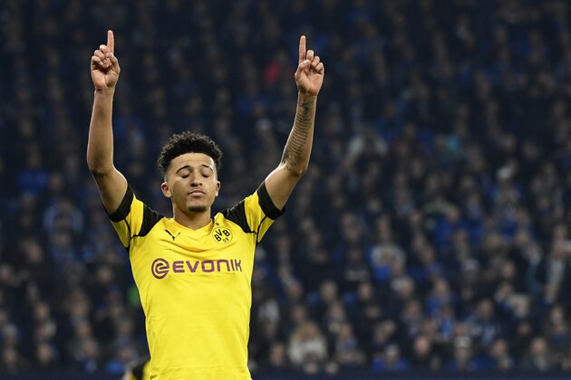 In this Dec. 8, 2018 photo Dortmund's Jadon Sancho celebrates during the Bundesliga soccer match between FC Schalke 04 and Borussia Dortmund in Gelsenkirchen, Germany. Saturday's 2-1 win at Schalke was Dortmund's first Ruhr derby win in three years. (Ina Fassbender/dpa via AP)