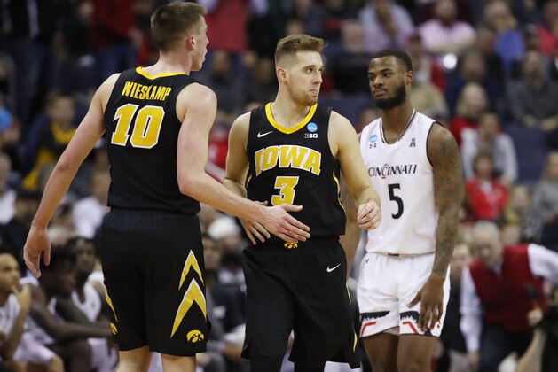 COLUMBUS, OHIO - MARCH 22: Jordan Bohannon #3 of the Iowa Hawkeyes reacts with Joe Wieskamp #10 during the first half against the Cincinnati Bearcats in the first round of the 2019 NCAA Men's Basketball Tournament at Nationwide Arena on March 22, 2019 in Columbus, Ohio. (Photo by Gregory Shamus/Getty Images)